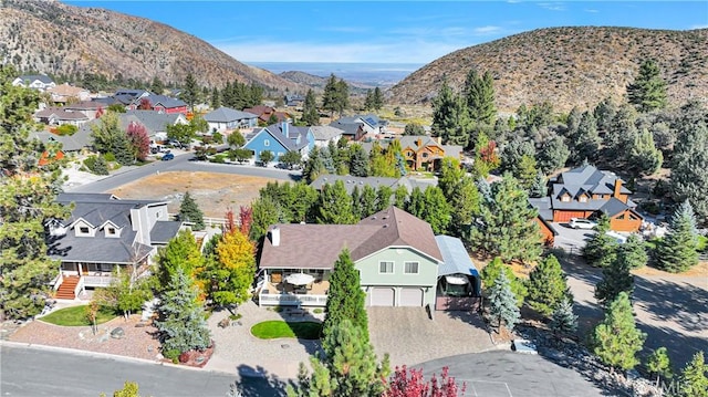 drone / aerial view featuring a mountain view and a residential view