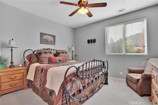bedroom with baseboards, visible vents, carpet floors, and ceiling fan