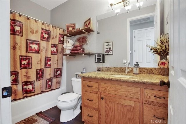 bathroom with shower / tub combo, toilet, and vanity