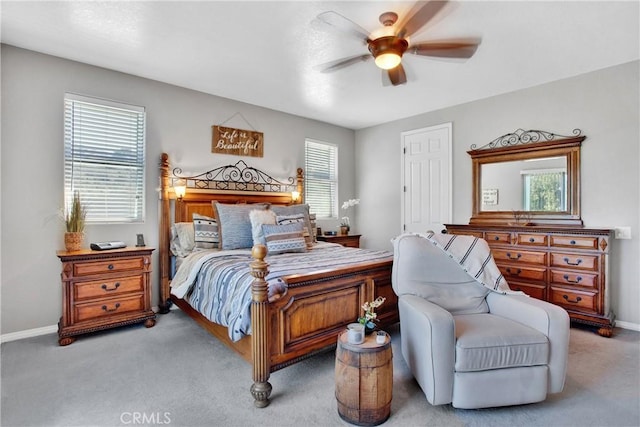 bedroom with baseboards, a ceiling fan, and carpet flooring
