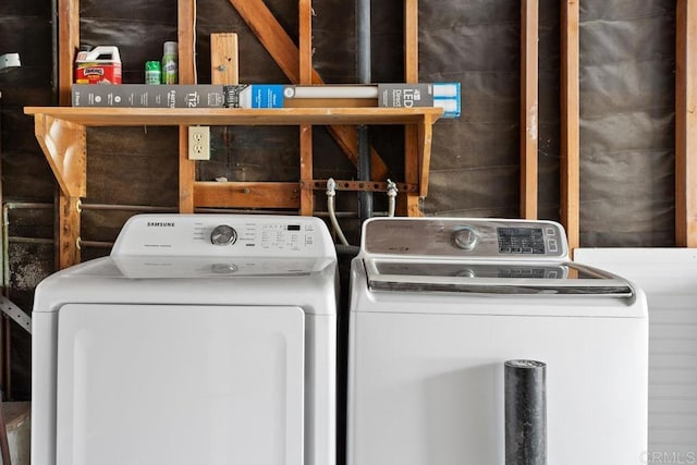 washroom featuring laundry area and washer and clothes dryer