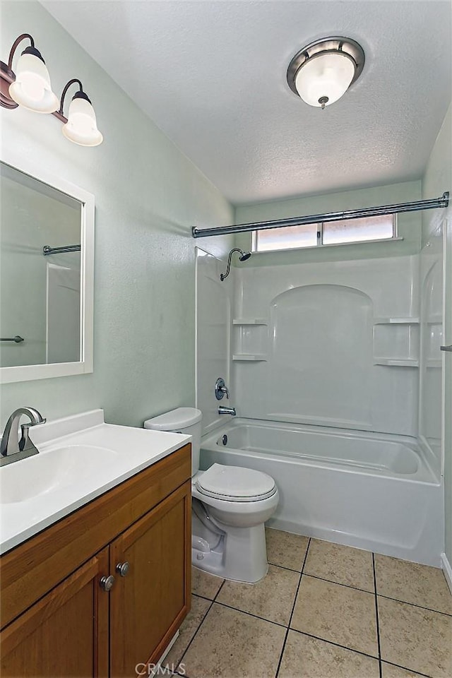 full bath featuring a textured ceiling, toilet, vanity, and tile patterned flooring