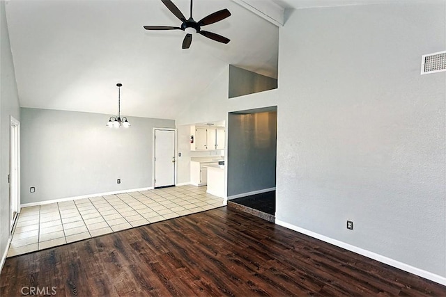 unfurnished living room featuring visible vents, light wood finished floors, baseboards, and ceiling fan with notable chandelier