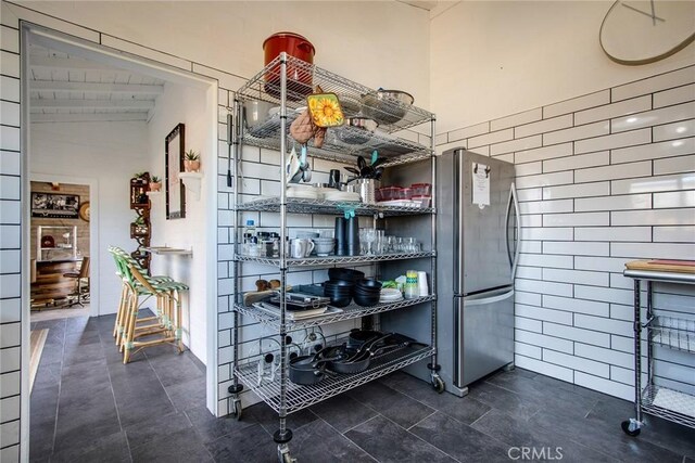 interior space featuring freestanding refrigerator