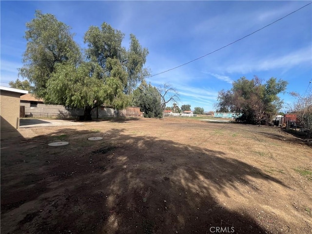 view of yard featuring fence