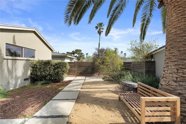 view of yard with a fenced backyard and a patio