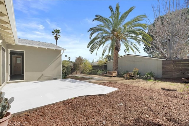 view of yard featuring entry steps, a patio area, and fence