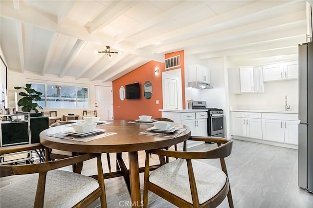 22470 Fawnridge Dr, Palm Springs, CA 92262 - dining space featuring lofted ceiling with beams and visible vents