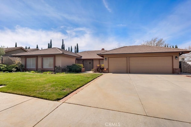 view of front of home with a tiled roof, an attached garage, concrete driveway, and a front lawn