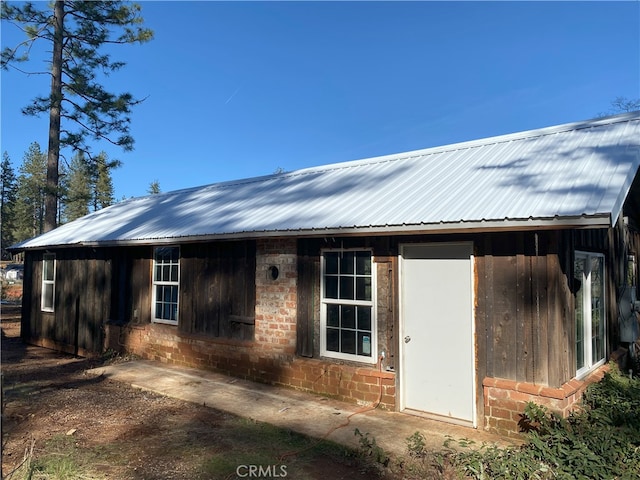 exterior space featuring metal roof