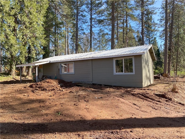 view of home's exterior with metal roof