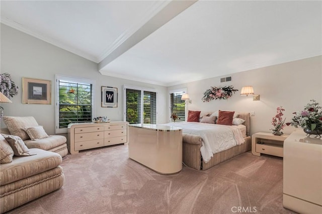 bedroom featuring visible vents, light carpet, lofted ceiling, and ornamental molding