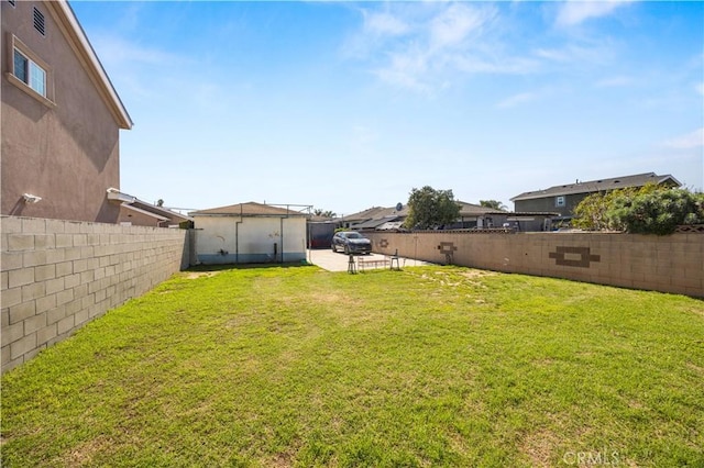 view of yard with a patio and a fenced backyard