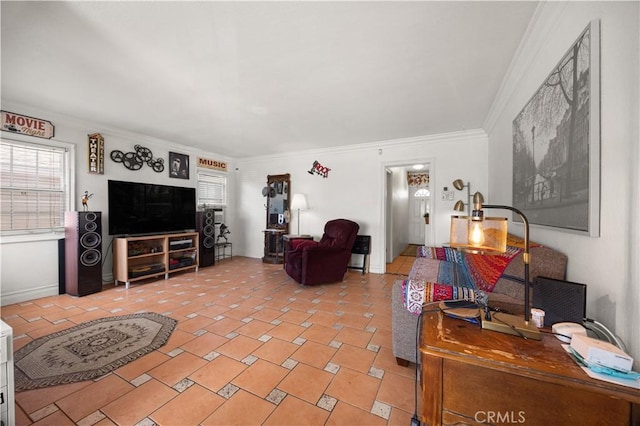 living area featuring a wealth of natural light and crown molding