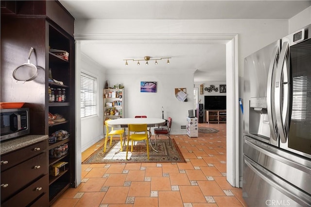 interior space featuring crown molding, dark brown cabinets, open shelves, and stainless steel appliances