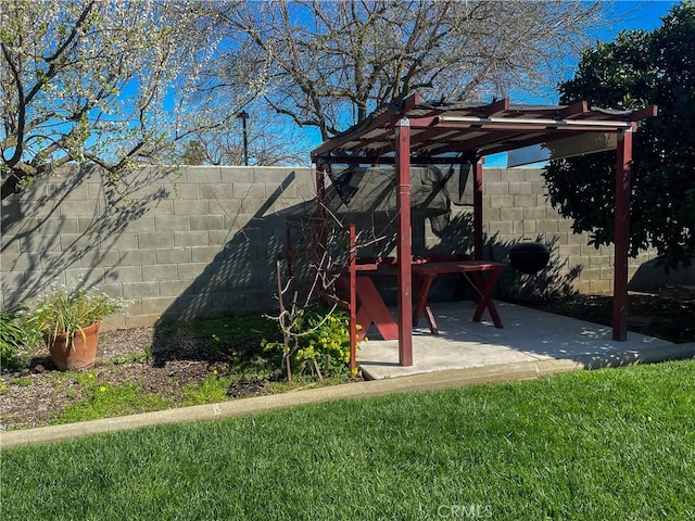 exterior space with a patio area, fence, and a pergola