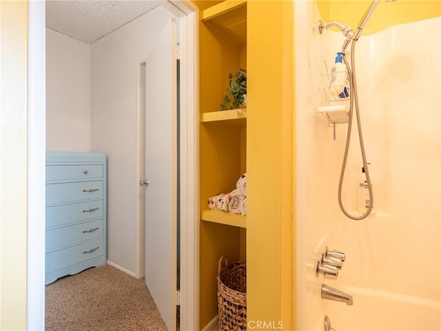 bathroom featuring shower / tub combination and a textured ceiling