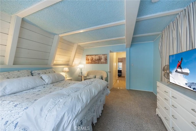 bedroom featuring carpet and a textured ceiling