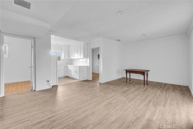 unfurnished living room featuring light wood-type flooring