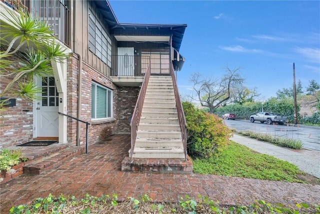 exterior space featuring brick siding and board and batten siding