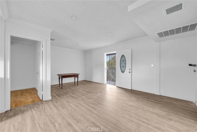 interior space featuring visible vents and light wood-style floors