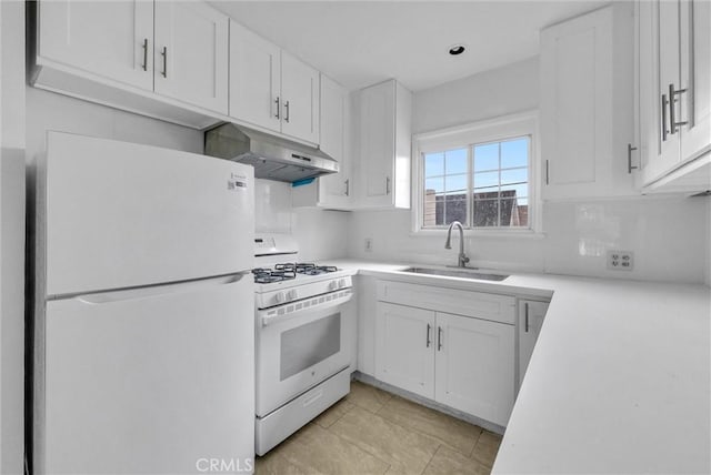 kitchen featuring light countertops, white cabinets, a sink, white appliances, and under cabinet range hood