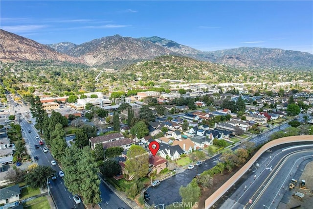 drone / aerial view featuring a residential view and a mountain view