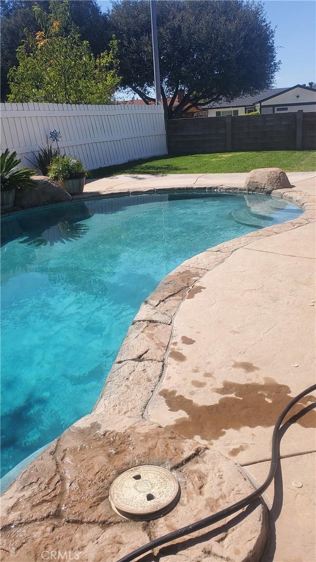 view of swimming pool featuring a fenced in pool and a fenced backyard