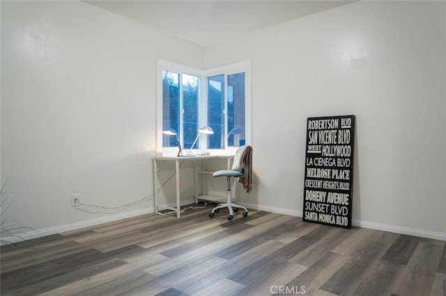 office area with plenty of natural light, baseboards, and wood finished floors