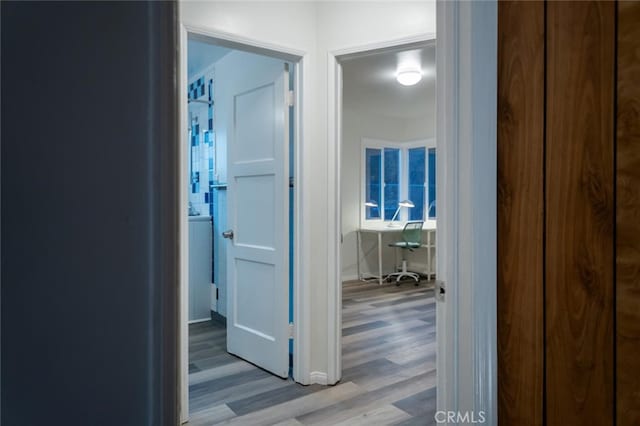 corridor with wood finished floors