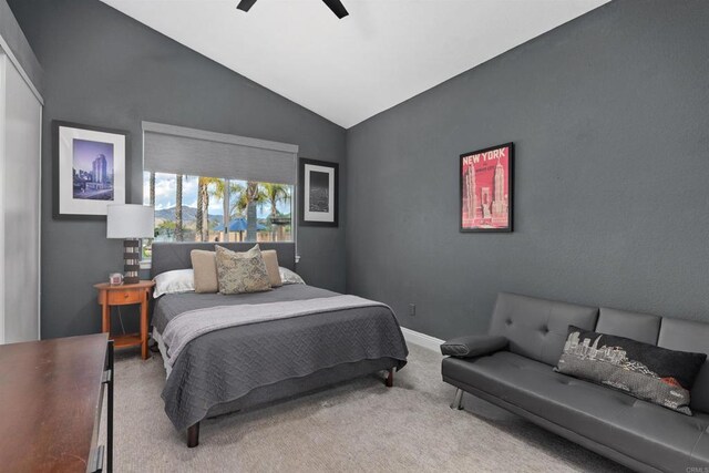 bedroom featuring baseboards, a ceiling fan, lofted ceiling, and carpet floors