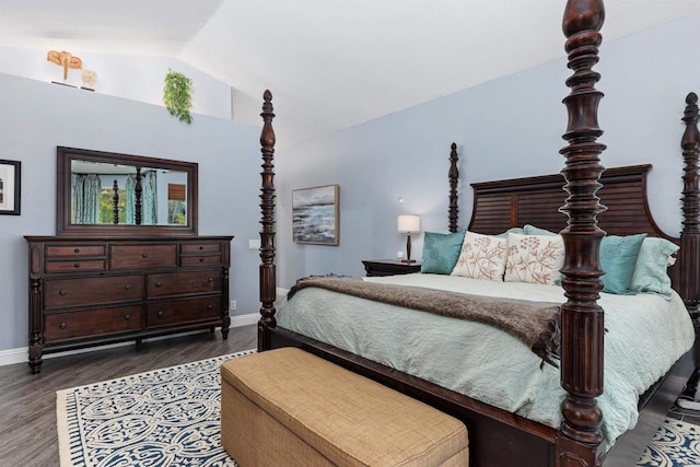 bedroom with baseboards, dark wood-style flooring, and vaulted ceiling