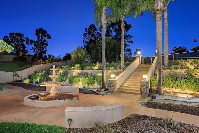 view of yard featuring stairs and fence