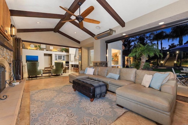 living room featuring beam ceiling, a stone fireplace, high vaulted ceiling, and ceiling fan