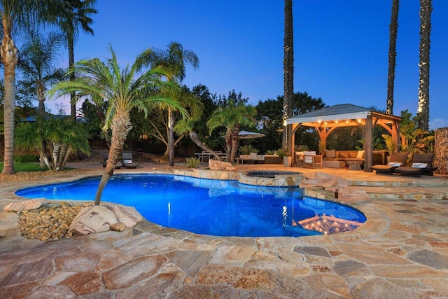 view of swimming pool with a gazebo, a patio, and a pool with connected hot tub