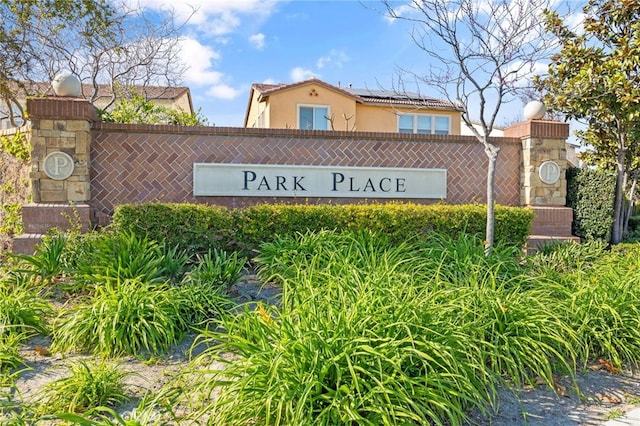 community sign with fence