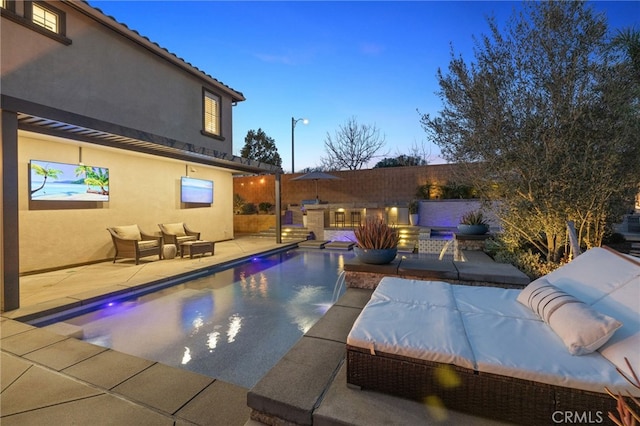 view of swimming pool with a fenced in pool, a patio area, fence, and an outdoor hangout area