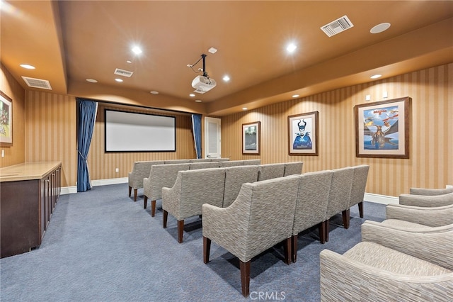 carpeted cinema room featuring wallpapered walls, recessed lighting, and visible vents