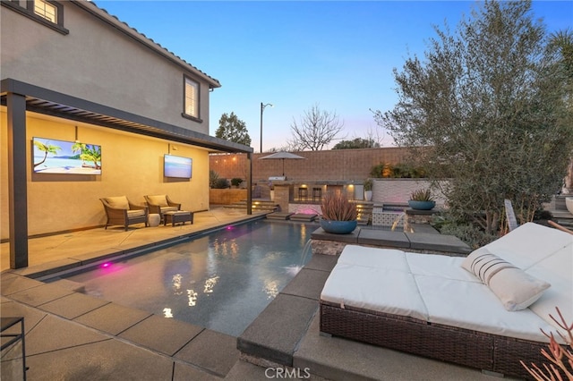 view of swimming pool featuring a fenced in pool, fence, and a patio area