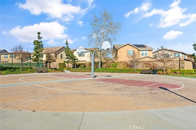 view of sport court with a residential view and community basketball court