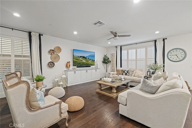 living area featuring baseboards, visible vents, recessed lighting, ceiling fan, and dark wood-type flooring