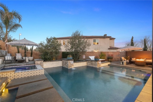 view of pool with area for grilling, a fenced backyard, a fenced in pool, an in ground hot tub, and a patio area