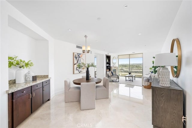 dining room with recessed lighting, marble finish floor, visible vents, and baseboards