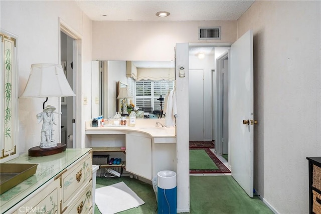 bathroom featuring visible vents and vanity