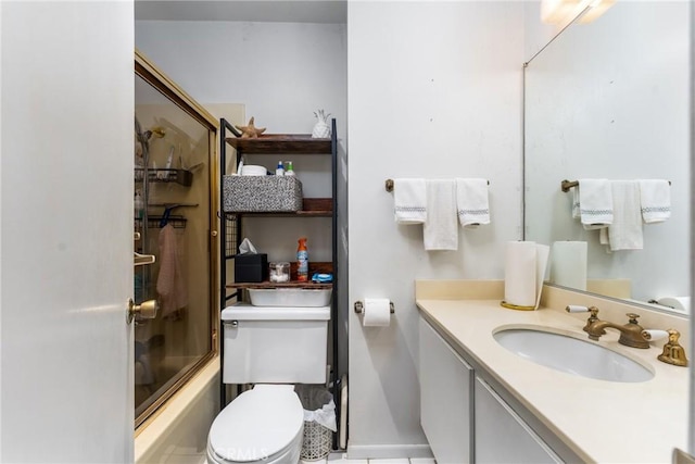 bathroom with bath / shower combo with glass door, vanity, and toilet