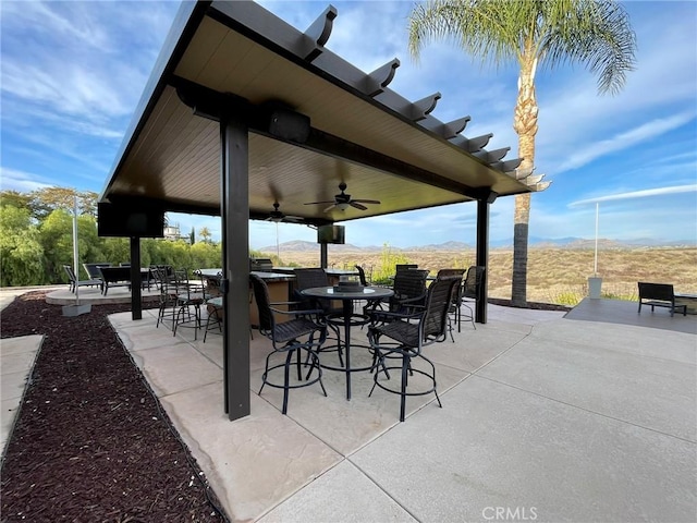 view of patio featuring ceiling fan