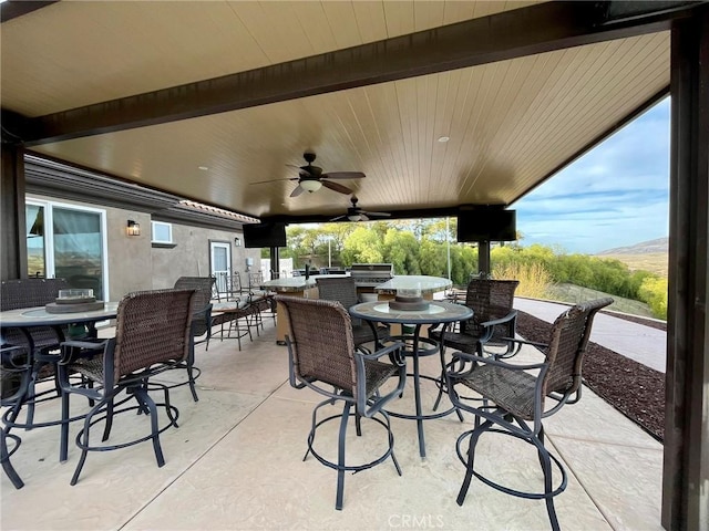 view of patio / terrace featuring outdoor dining area and ceiling fan