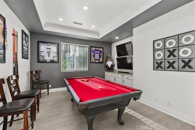 playroom featuring visible vents, ornamental molding, billiards, a tray ceiling, and light wood finished floors