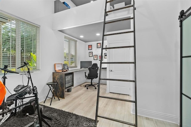 office featuring baseboards and light wood-style floors