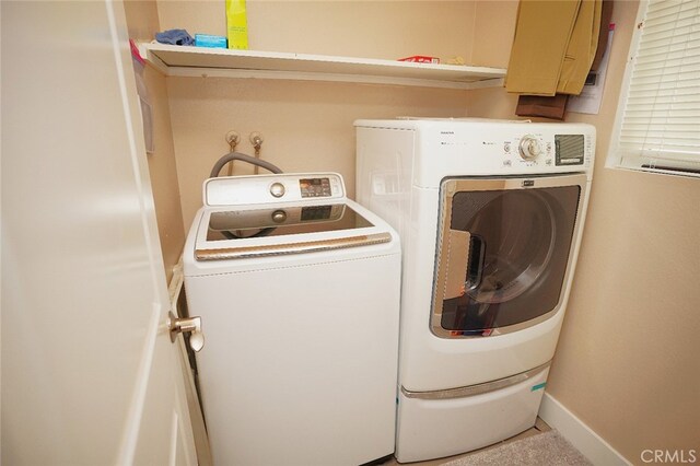 30266 Via Reata, Laguna Niguel, CA 92677 - washroom featuring washer and clothes dryer and baseboards